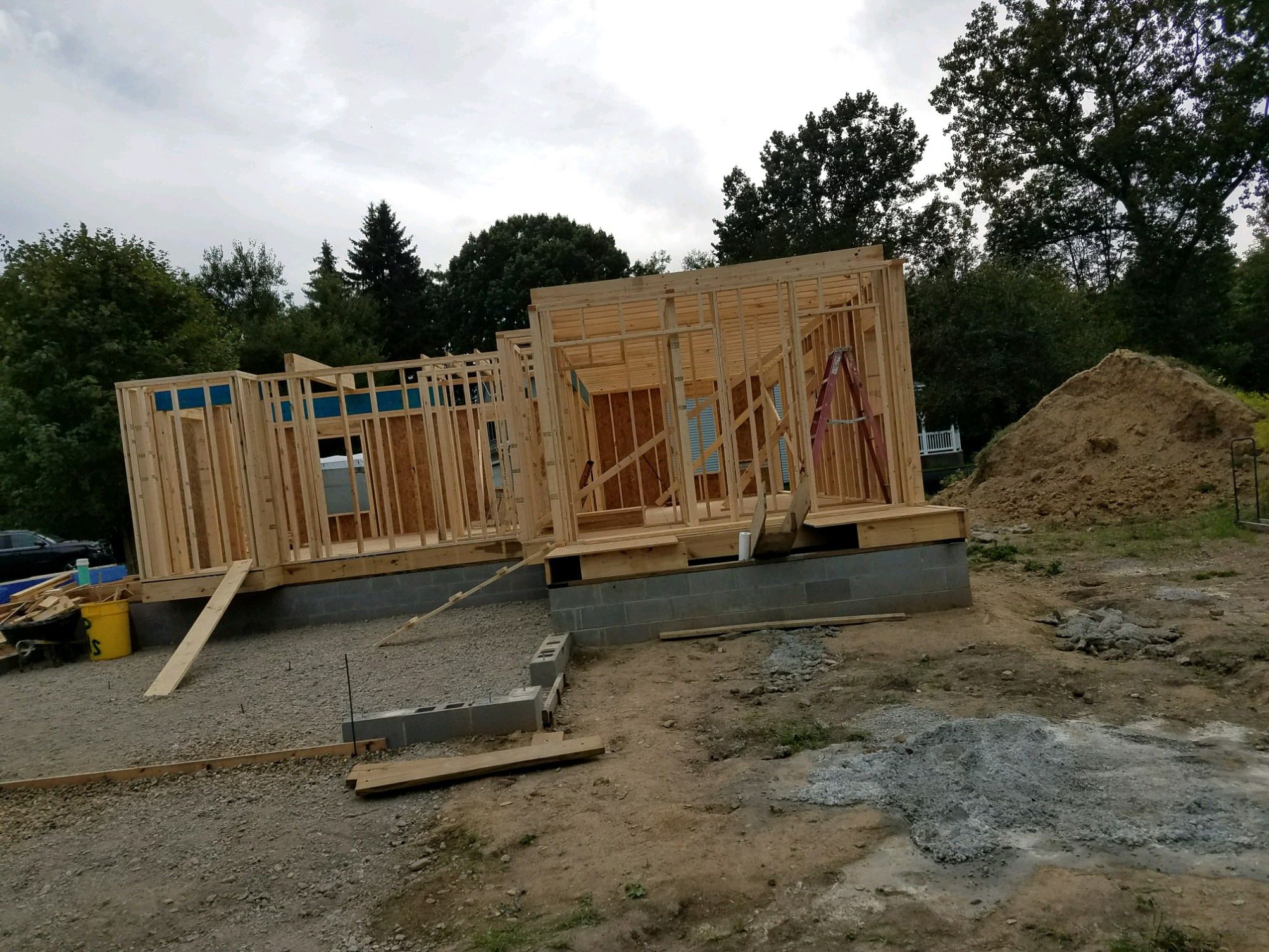 First-floor wall framing complete on the block foundation.